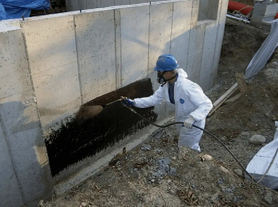 Professional waterproofing the exterior walls of the basement in Long Beach, CA