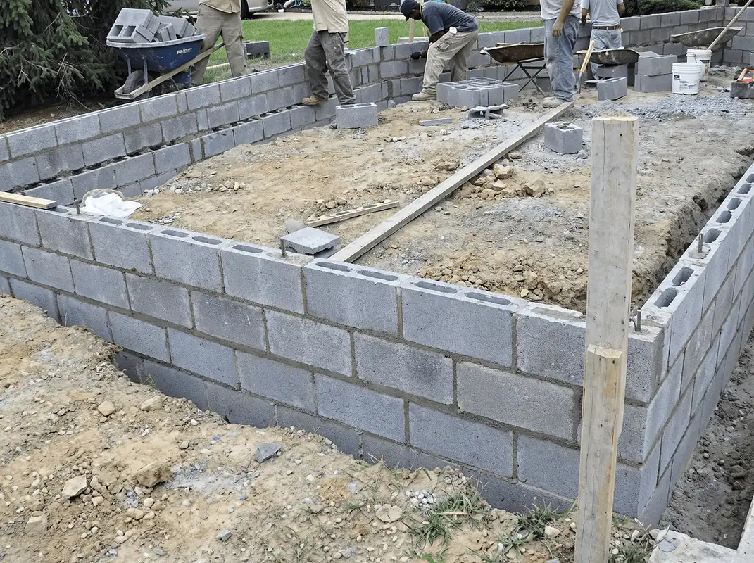 Professionals building a foundation with blocks in Long Beach, CA