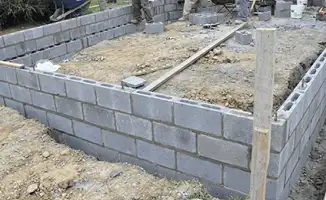 Professionals building a foundation with blocks in Long Beach, CA
