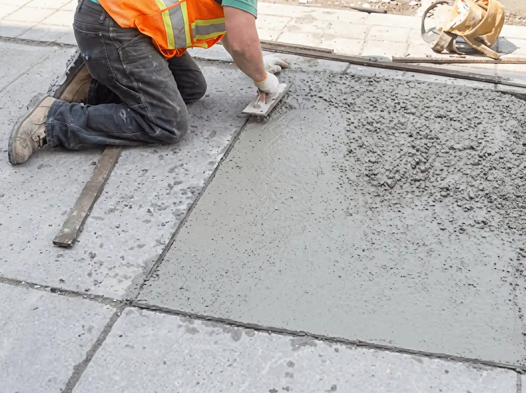 Professional repairing a concrete floor in Long Beach, CA